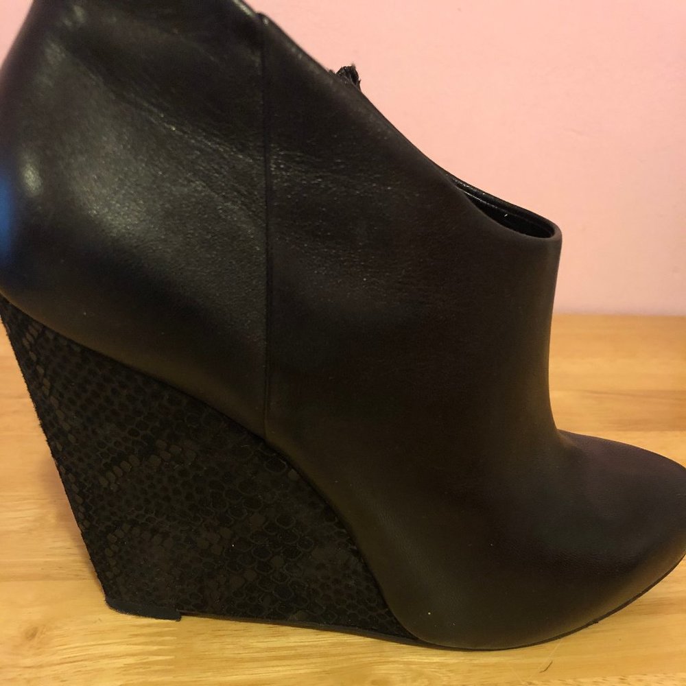 guess black leather wedge bootie.